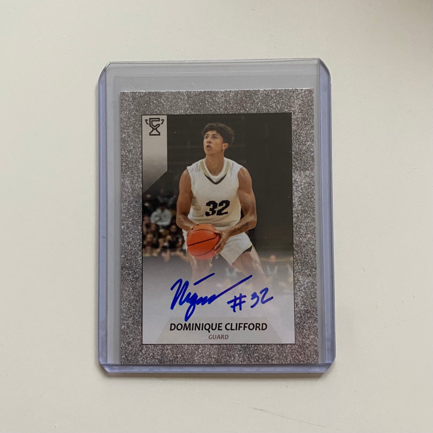 Autographed trading card of Dominique Clifford in white uniform.